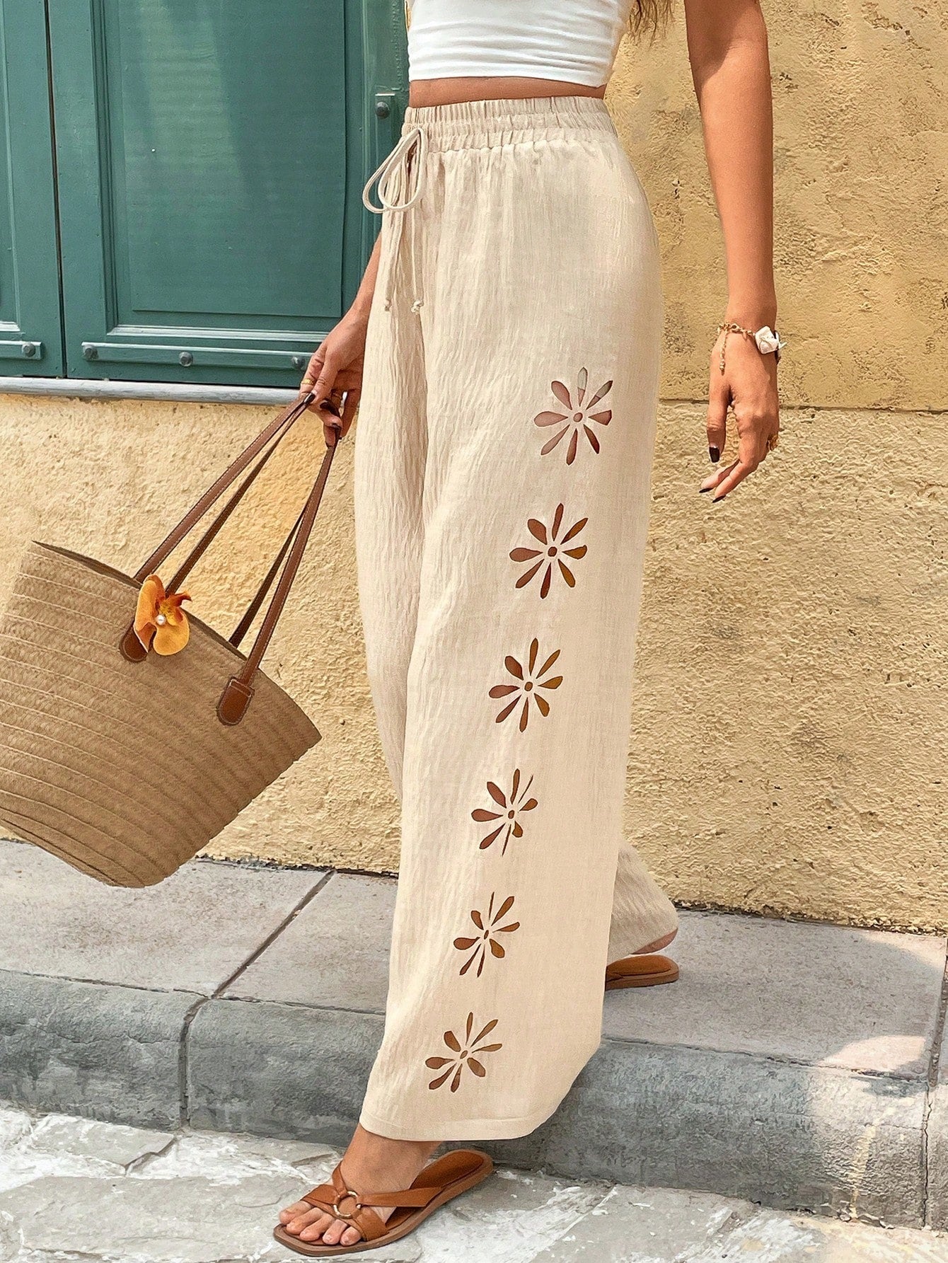 Pants With Knotted Drawstring And Floral Cutouts